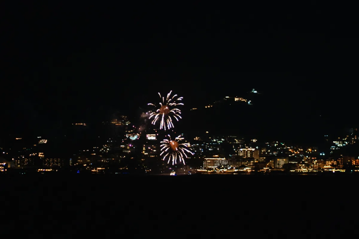 cabo destination wedding fireworks the cape thompson hotel - Luxury Cabo Wedding at The Cape, a Thompson Hotel Fireworks display over Cabo San Lucas cityscape during luxury destination wedding celebration at The Cape, a Thompson Hotel