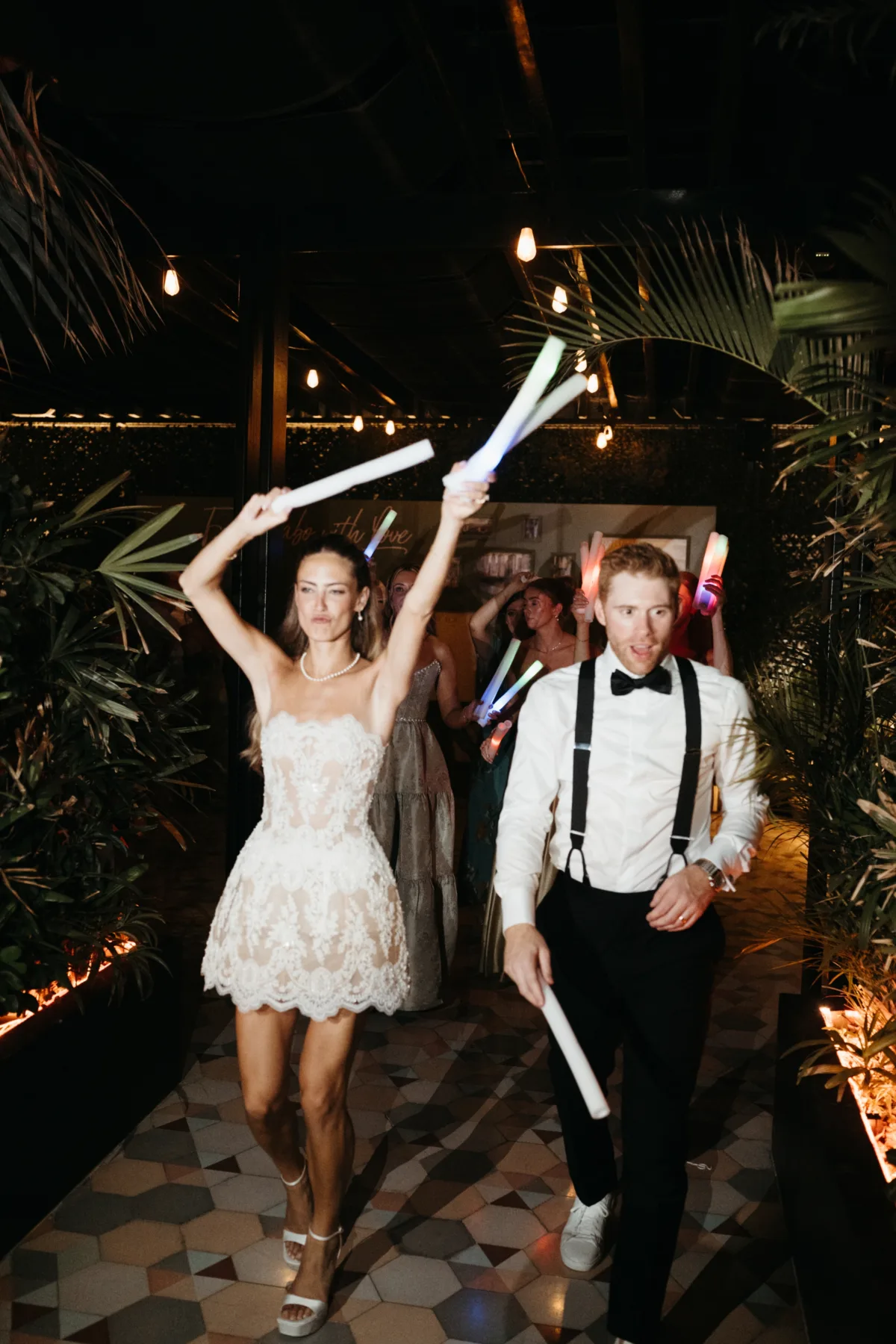 cabo destination wedding reception dancing engaging events by ali chicago wedding planner 1 - Luxury Cabo Wedding at The Cape, a Thompson Hotel Bride and groom dancing with glow sticks at luxury Cabo destination wedding reception at The Cape Thompson Hotel planned by Chicago wedding planner Engaging Events by Ali