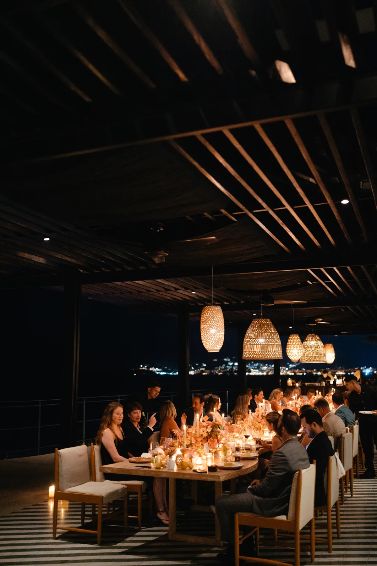 destination wedding reception dinner cabo thompson hotel engaging events - Luxury Cabo Wedding at The Cape, a Thompson Hotel Luxury destination wedding reception dinner at The Cape Thompson Hotel in Cabo San Lucas planned by Engaging Events by Ali with woven pendant lighting and candlelit tablescape