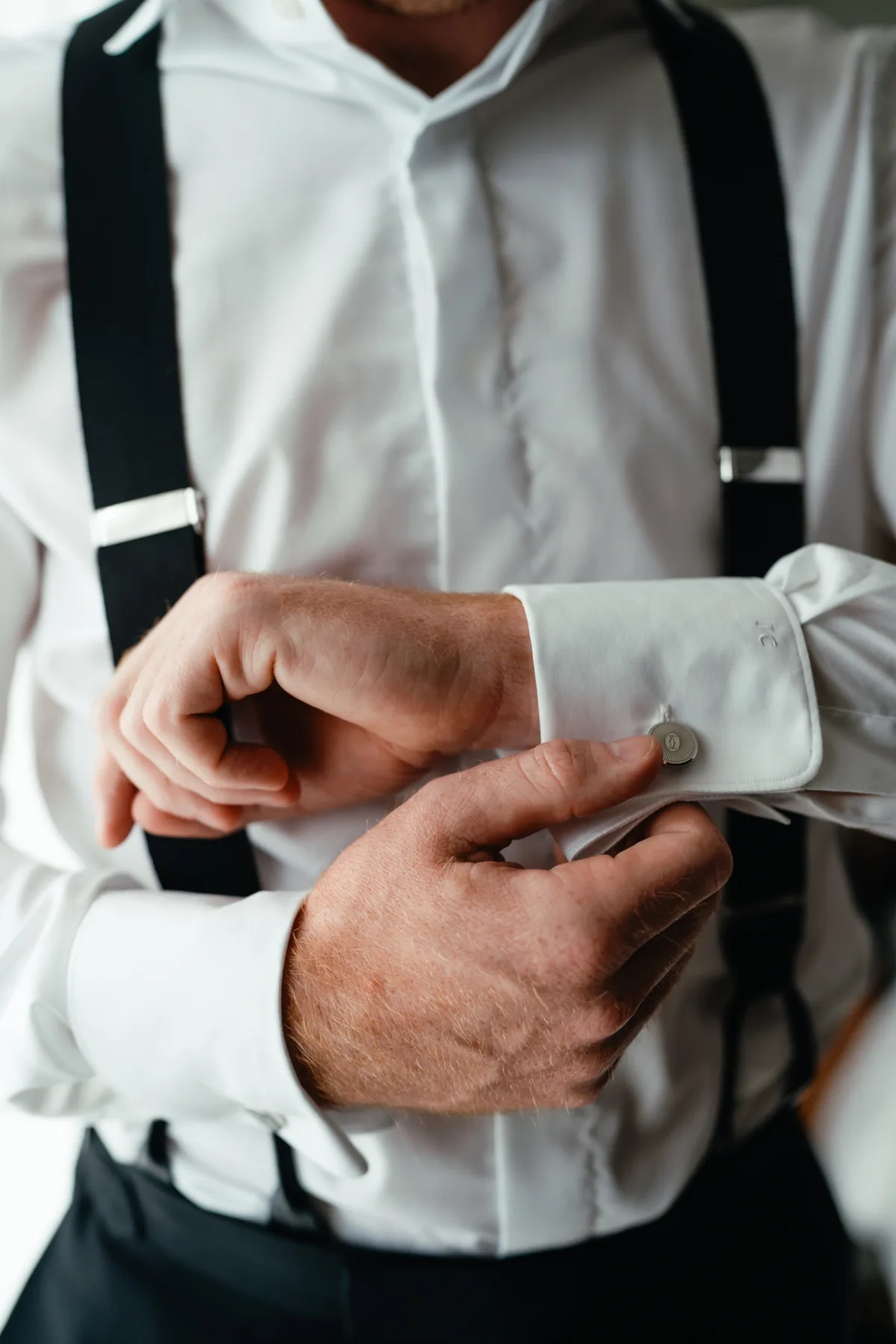 groom getting ready cufflinks luxury cabo wedding the cape thompson hotel - Luxury Cabo Wedding at The Cape, a Thompson Hotel Groom putting on cufflinks while getting ready for luxury destination wedding at The Cape, a Thompson Hotel in Cabo San Lucas