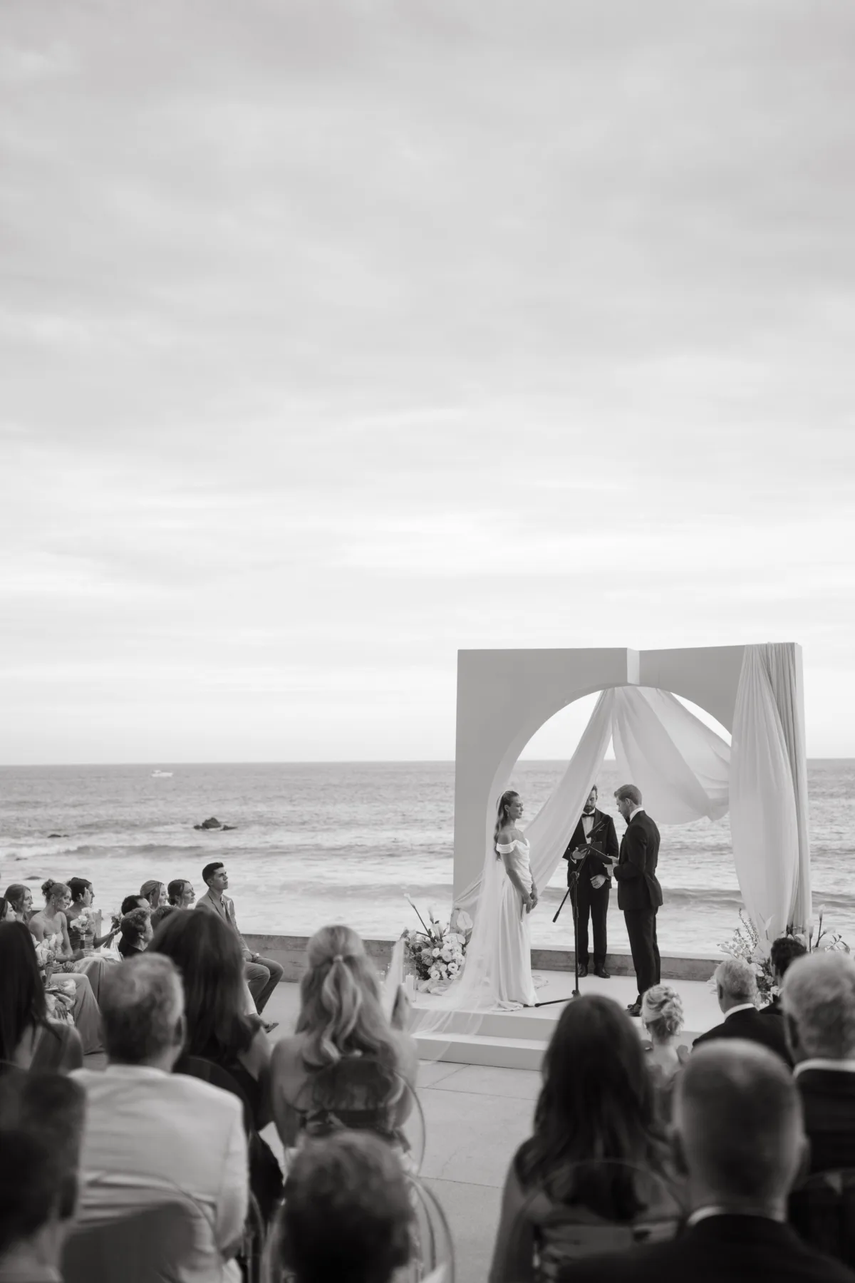 luxury cabo beach wedding ceremony engaging events ali thompson hotel - Luxury Cabo Wedding at The Cape, a Thompson Hotel Luxury beach wedding ceremony at The Cape Thompson Hotel in Cabo San Lucas planned by Engaging Events by Ali featuring oceanfront altar with flowing white draping