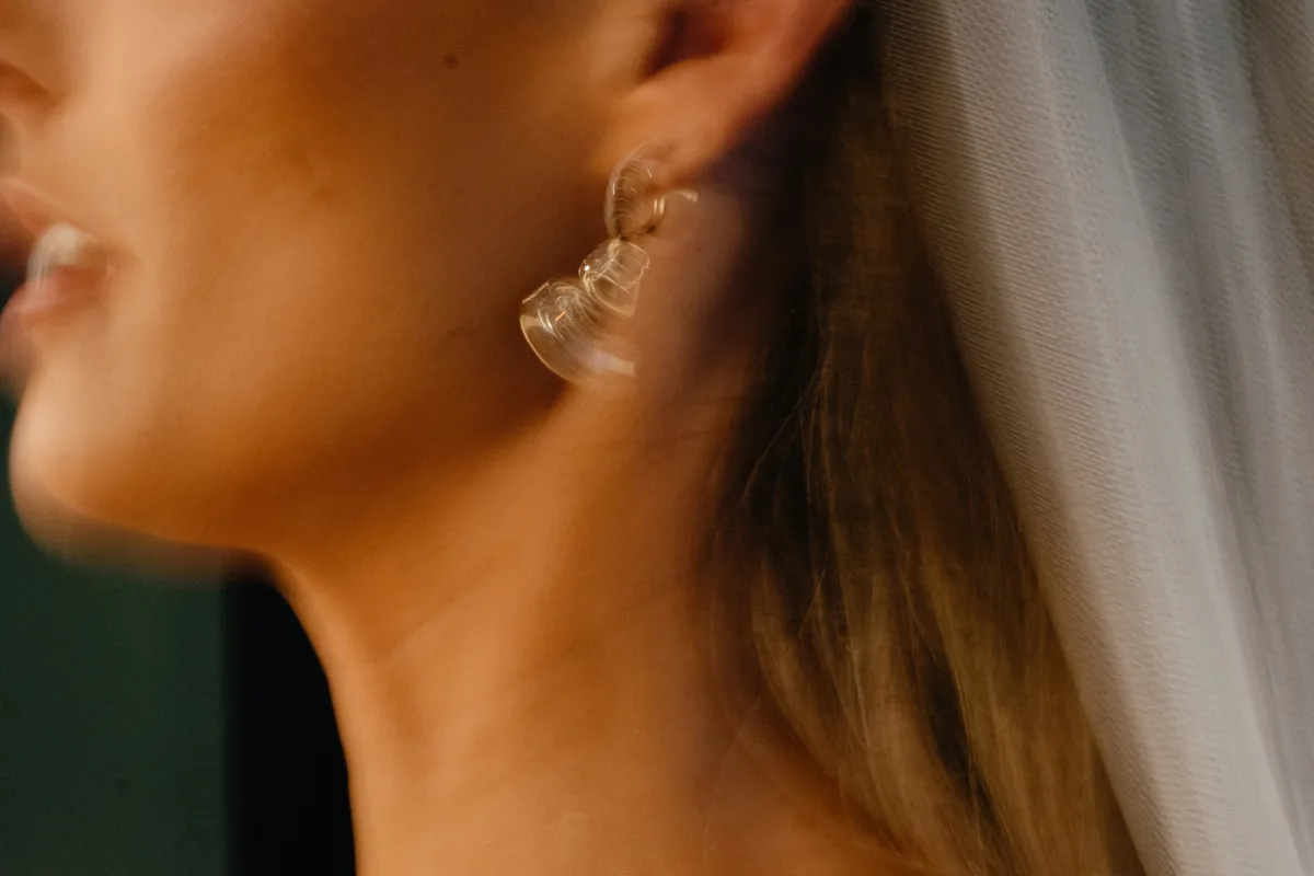 luxury cabo destination wedding bride getting ready the cape thompson hotel - Luxury Cabo Wedding at The Cape, a Thompson Hotel Bride getting ready with elegant earrings for luxury destination wedding at The Cape, a Thompson Hotel in Cabo San Lucas