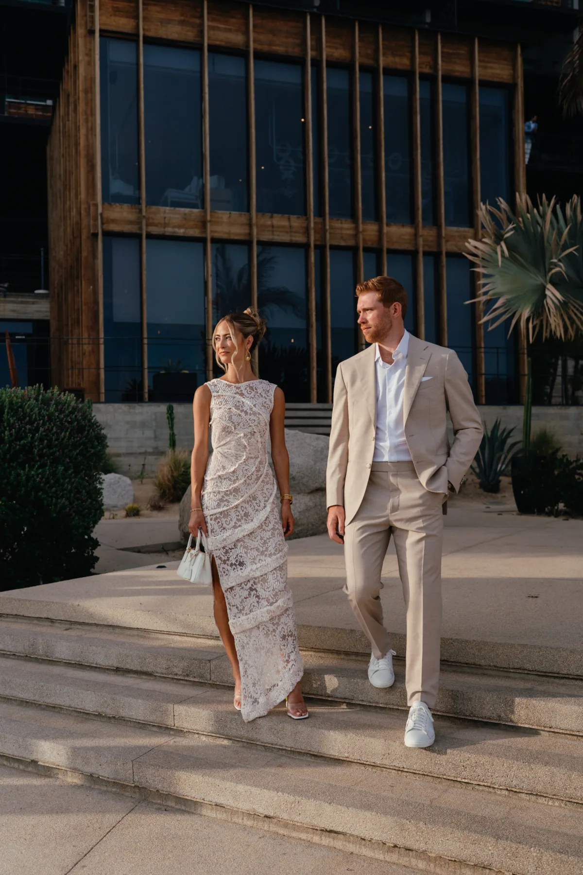 luxury cabo destination wedding cape thompson hotel engaging events ali - Luxury Cabo Wedding at The Cape, a Thompson Hotel Elegant couple walking at luxury Cabo destination wedding at The Cape Thompson Hotel planned by Engaging Events by Ali