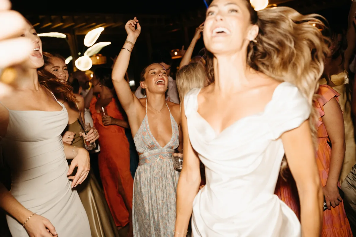 luxury cabo destination wedding dancing reception engaging events by ali - Luxury Cabo Wedding at The Cape, a Thompson Hotel Bride and guests dancing at luxury destination wedding reception at The Cape Thompson Hotel in Cabo San Lucas planned by Chicago wedding planner Engaging Events by Ali