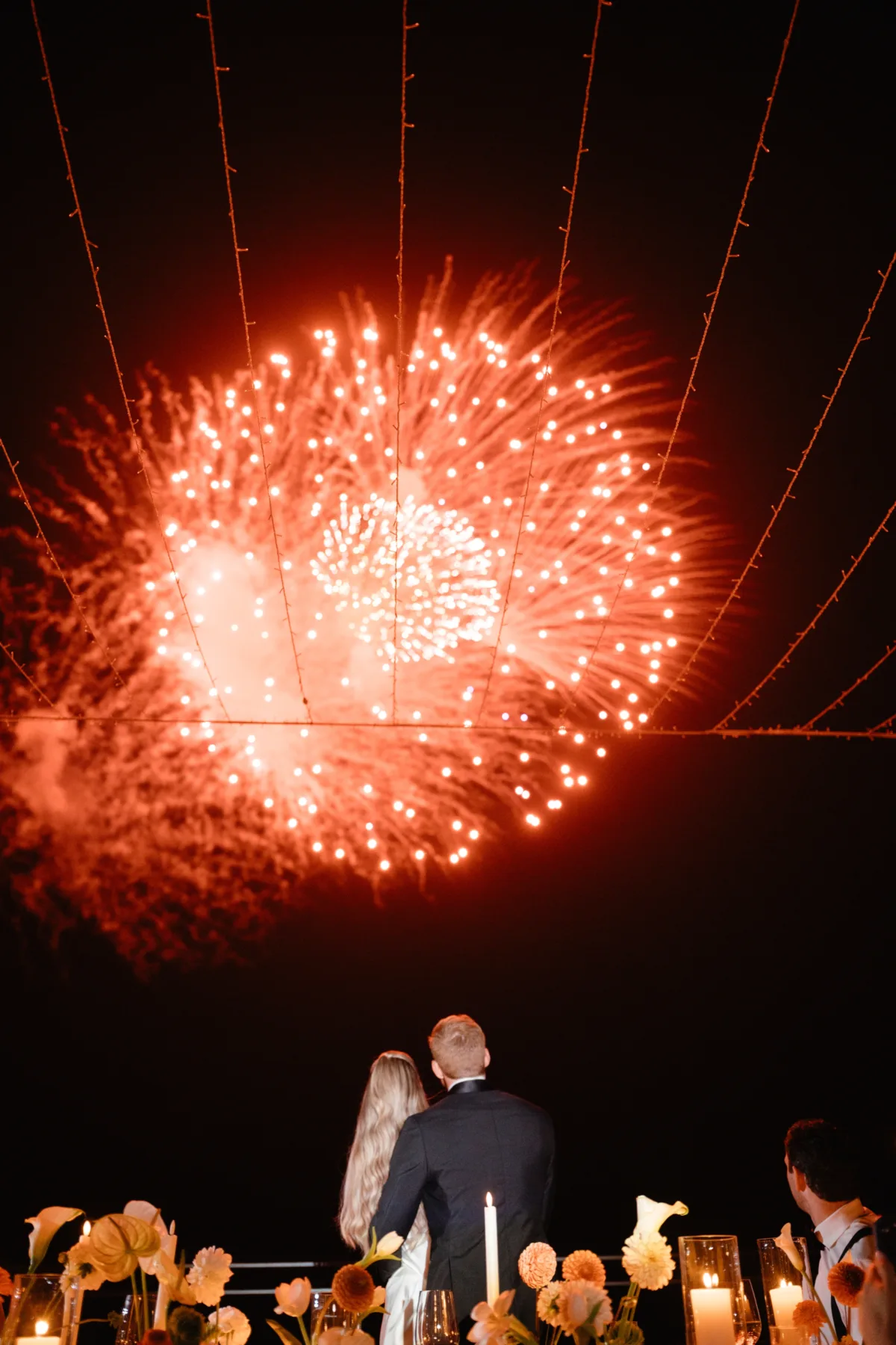 luxury cabo destination wedding fireworks engaging events ali wedding planning - Luxury Cabo Wedding at The Cape, a Thompson Hotel Bride and groom watching spectacular fireworks display at luxury destination wedding in Cabo San Lucas at The Cape Thompson Hotel planned by Chicago wedding planner Engaging Events by Ali