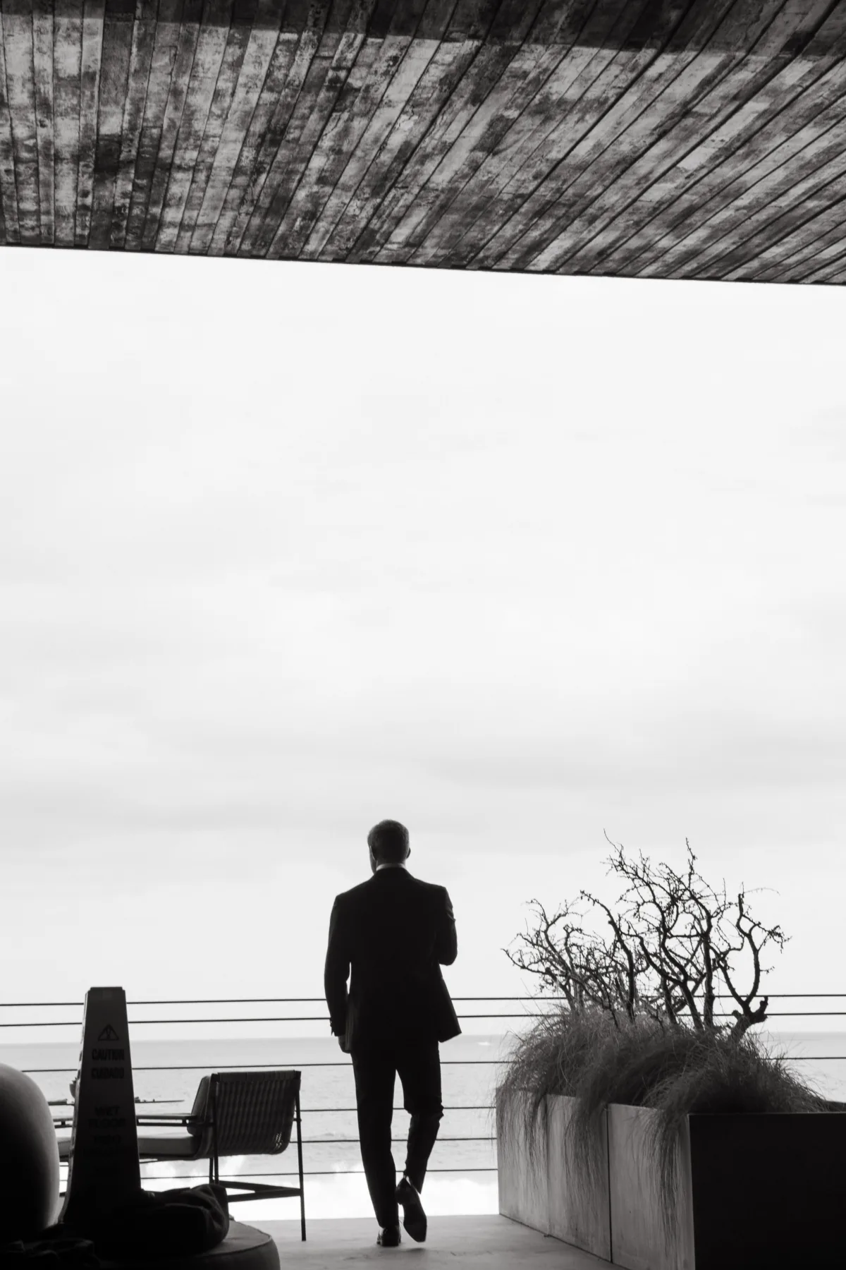 luxury cabo destination wedding planning engaging events by ali cape thompson hotel - Luxury Cabo Wedding at The Cape, a Thompson Hotel Groom in black suit overlooking ocean view at luxury Cabo destination wedding at The Cape Thompson Hotel planned by Engaging Events by Ali