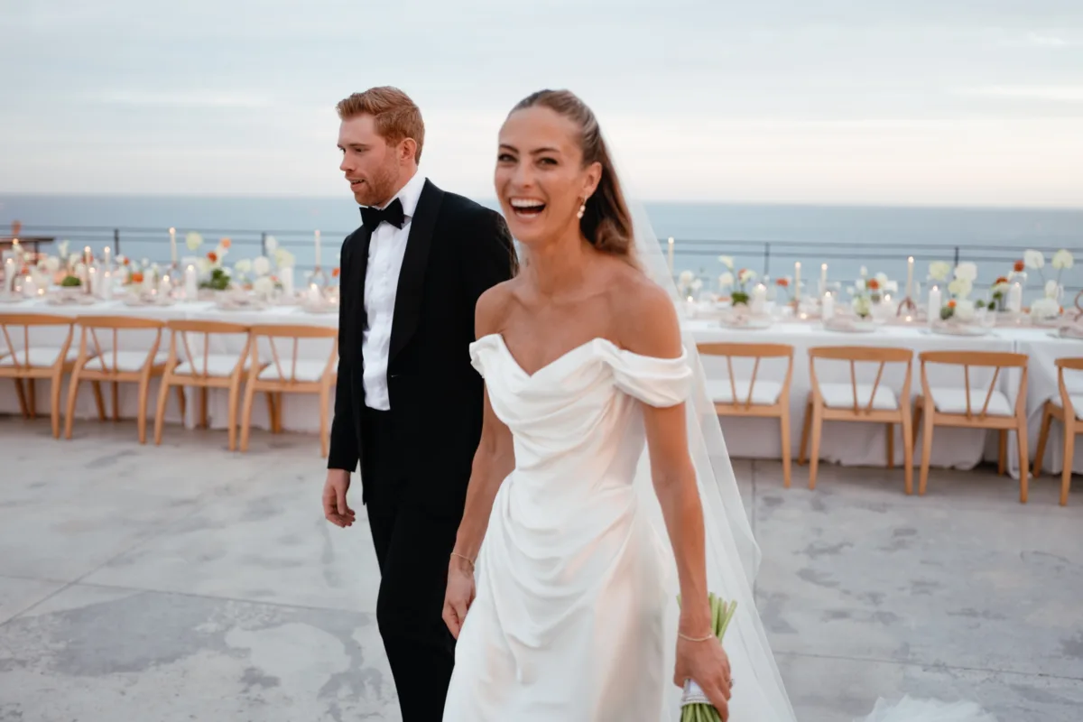 luxury cabo destination wedding planning engaging events by ali the cape thompson hotel 1 - Luxury Cabo Wedding at The Cape, a Thompson Hotel Luxury destination wedding couple walking at oceanfront reception at The Cape, a Thompson Hotel in Cabo San Lucas planned by Chicago wedding planner Engaging Events by Ali