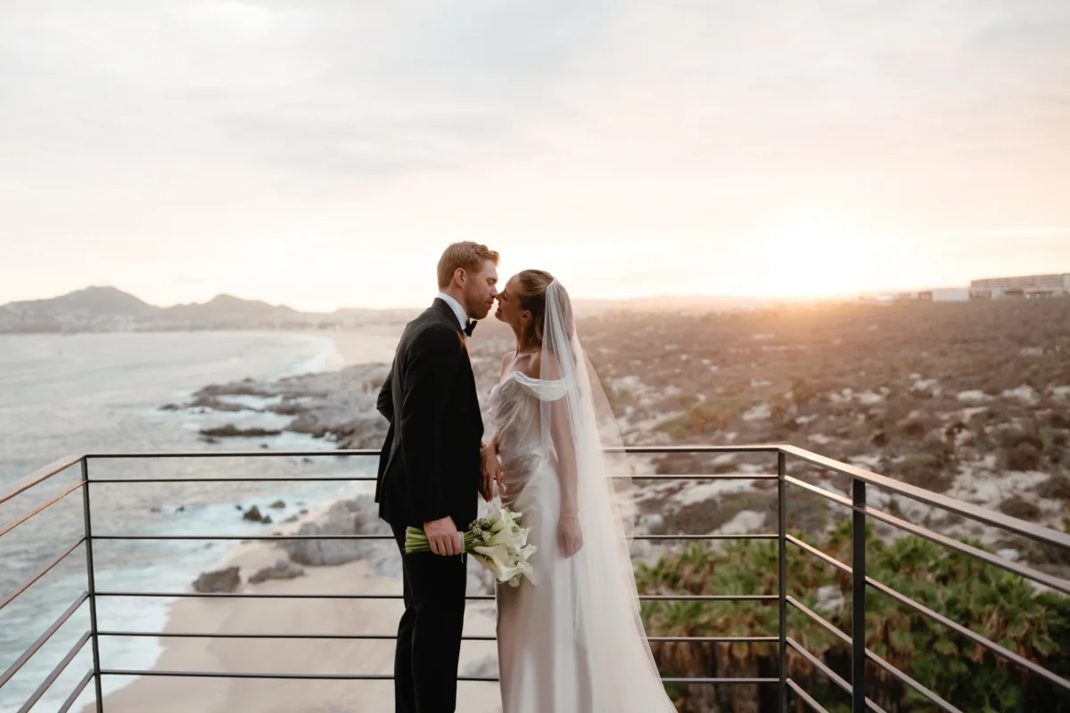luxury cabo destination wedding planning engaging events by ali the cape thompson hotel 2 - Luxury Cabo Wedding at The Cape, a Thompson Hotel Luxury destination wedding couple at sunset overlooking Cabo San Lucas coastline at The Cape, a Thompson Hotel, planned by Chicago wedding planner Engaging Events by Ali