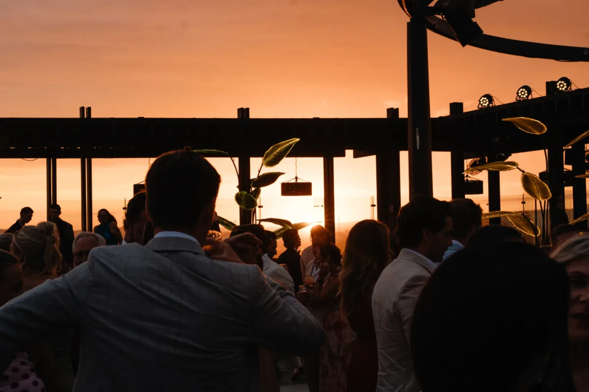 luxury cabo destination wedding sunset reception the cape thompson hotel - Luxury Cabo Wedding at The Cape, a Thompson Hotel Luxury destination wedding reception at sunset with guests enjoying cocktail hour at The Cape, a Thompson Hotel in Cabo San Lucas, planned by Chicago wedding planner Engaging Events by Ali