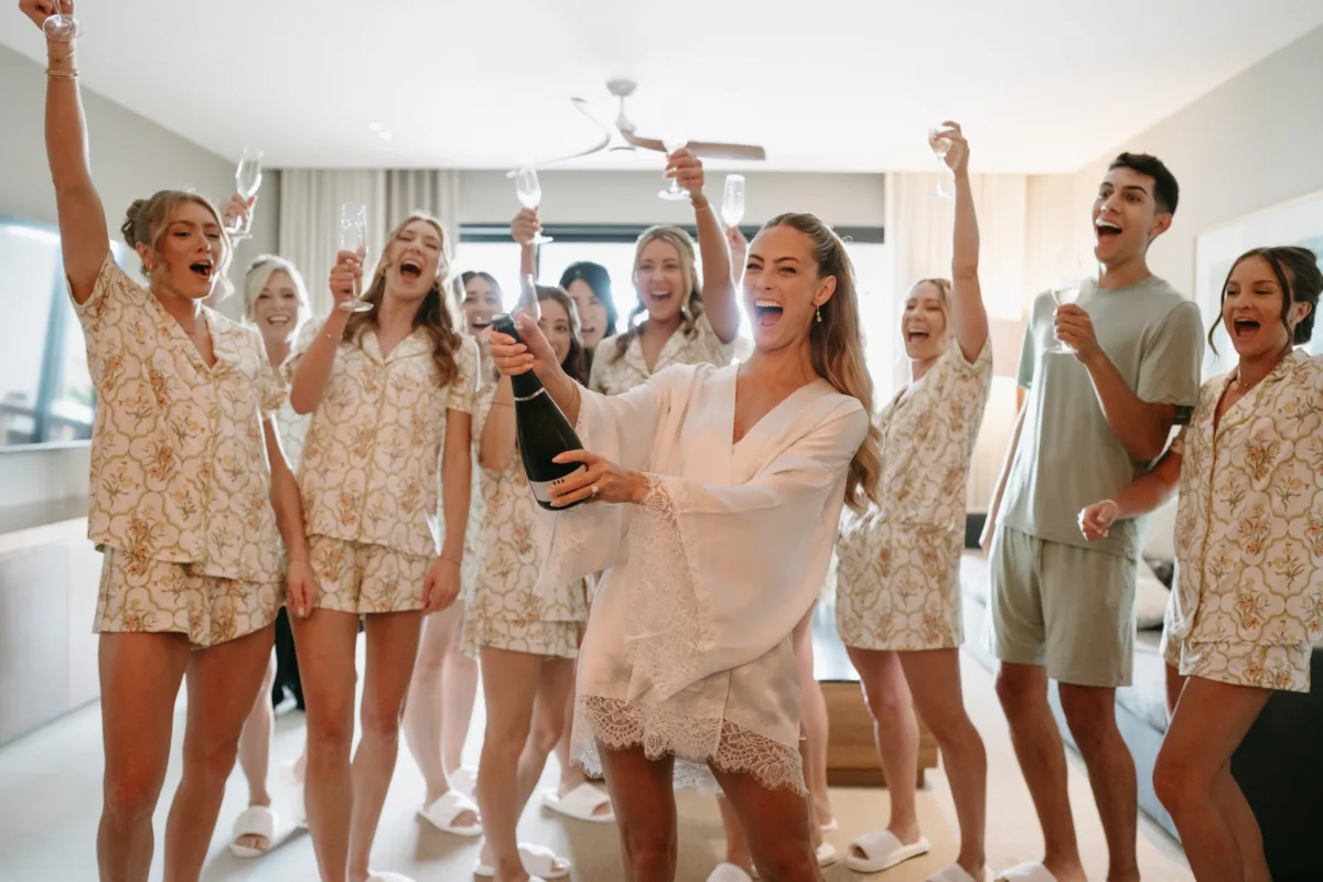 luxury cabo wedding bridal party getting ready champagne celebration the cape thompson hotel - Luxury Cabo Wedding at The Cape, a Thompson Hotel Bride and bridesmaids celebrating with champagne during getting ready at luxury Cabo wedding at The Cape, a Thompson Hotel