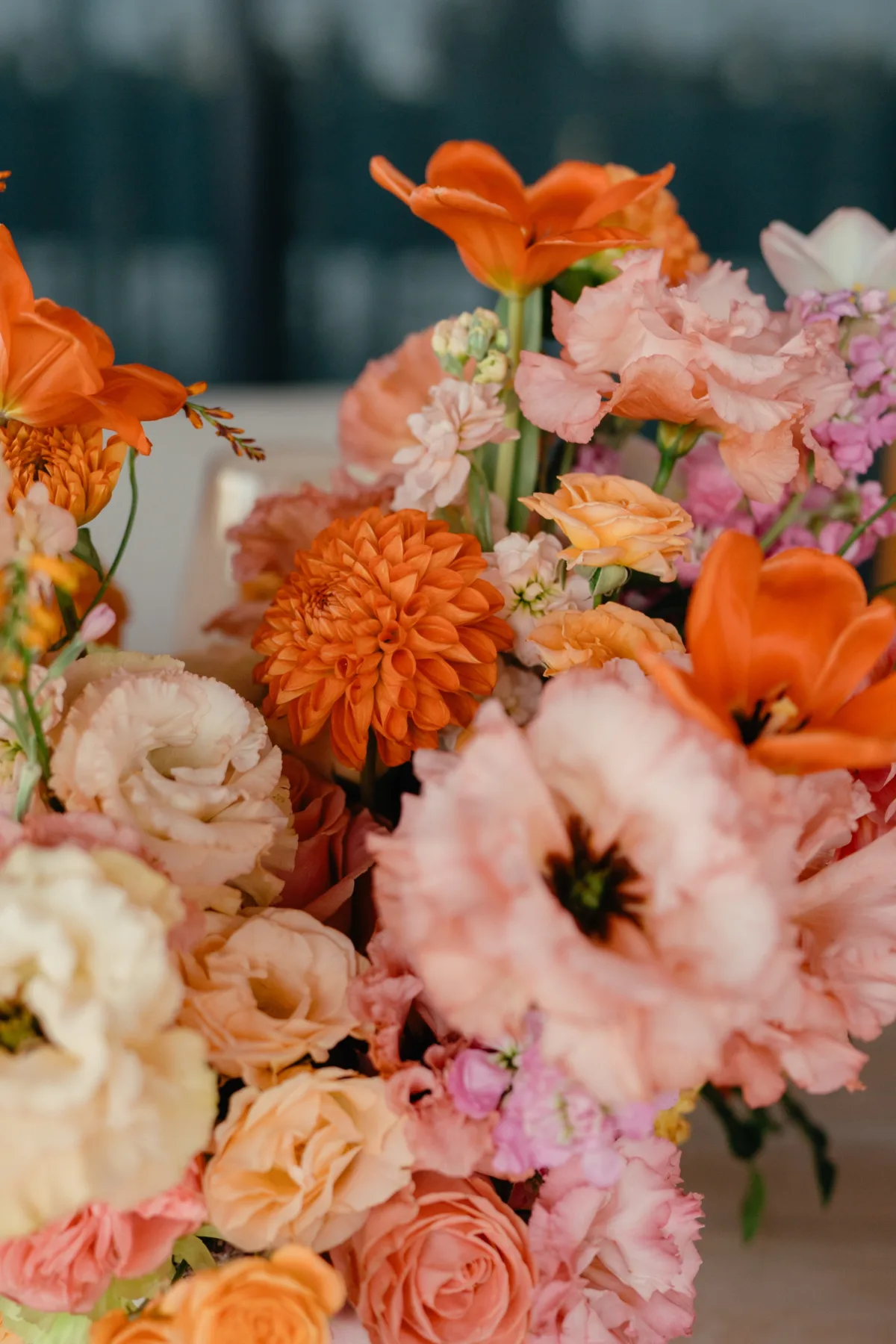 luxury cabo wedding florist aria vera floral arrangement cape thompson hotel - Luxury Cabo Wedding at The Cape, a Thompson Hotel Vibrant orange and pink wedding floral arrangement by Aria Vera Floral featuring dahlias and roses at luxury Cabo destination wedding at The Cape, a Thompson Hotel