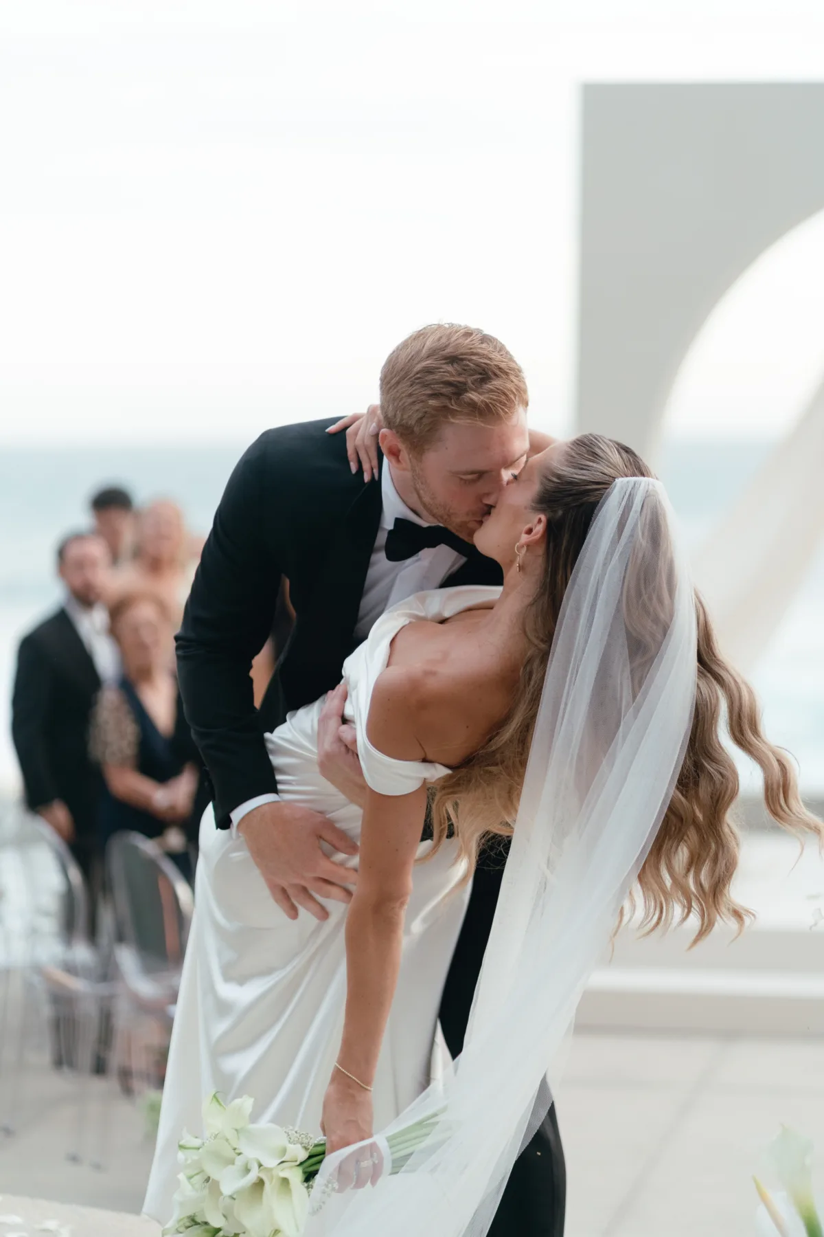 luxury cabo wedding planning engaging events by ali the cape thompson hotel 3 - Luxury Cabo Wedding at The Cape, a Thompson Hotel Luxury destination wedding ceremony kiss at The Cape Thompson Hotel in Cabo San Lucas planned by Engaging Events by Ali with ocean views