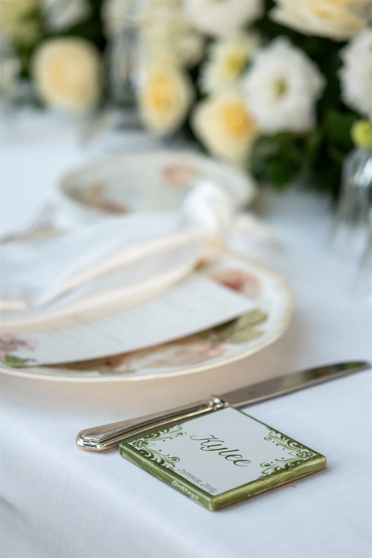 alice place card elegant wedding table setting sorrento italy engaging events - An Effortless Amalfi Coast Celebration Elegant Alice place card with ornate green border on formal wedding table setting at Capo Santa Fortunata in Sorrento Italy planned by Engaging Events by Ali