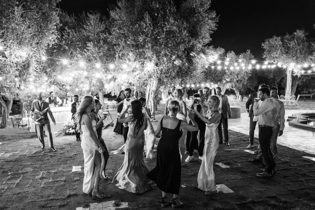 amalfi coast wedding reception dancing engaging events ali capo santa fortunata - An Effortless Amalfi Coast Celebration Wedding guests dancing under string lights at Capo Santa Fortunata venue in Sorrento Italy planned by Engaging Events by Ali