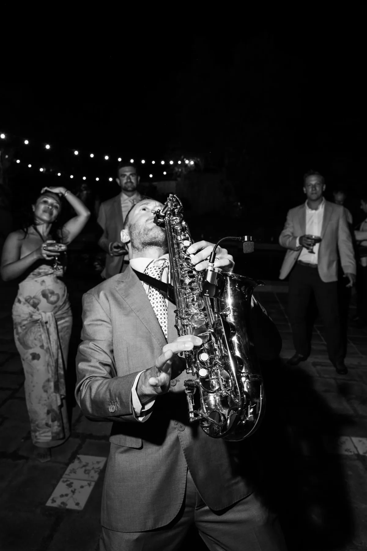 amalfi coast wedding saxophone entertainment engaging events by ali planning - An Effortless Amalfi Coast Celebration Saxophone musician performing at elegant Amalfi Coast destination wedding at Capo Santa Fortunata venue planned by Engaging Events by Ali