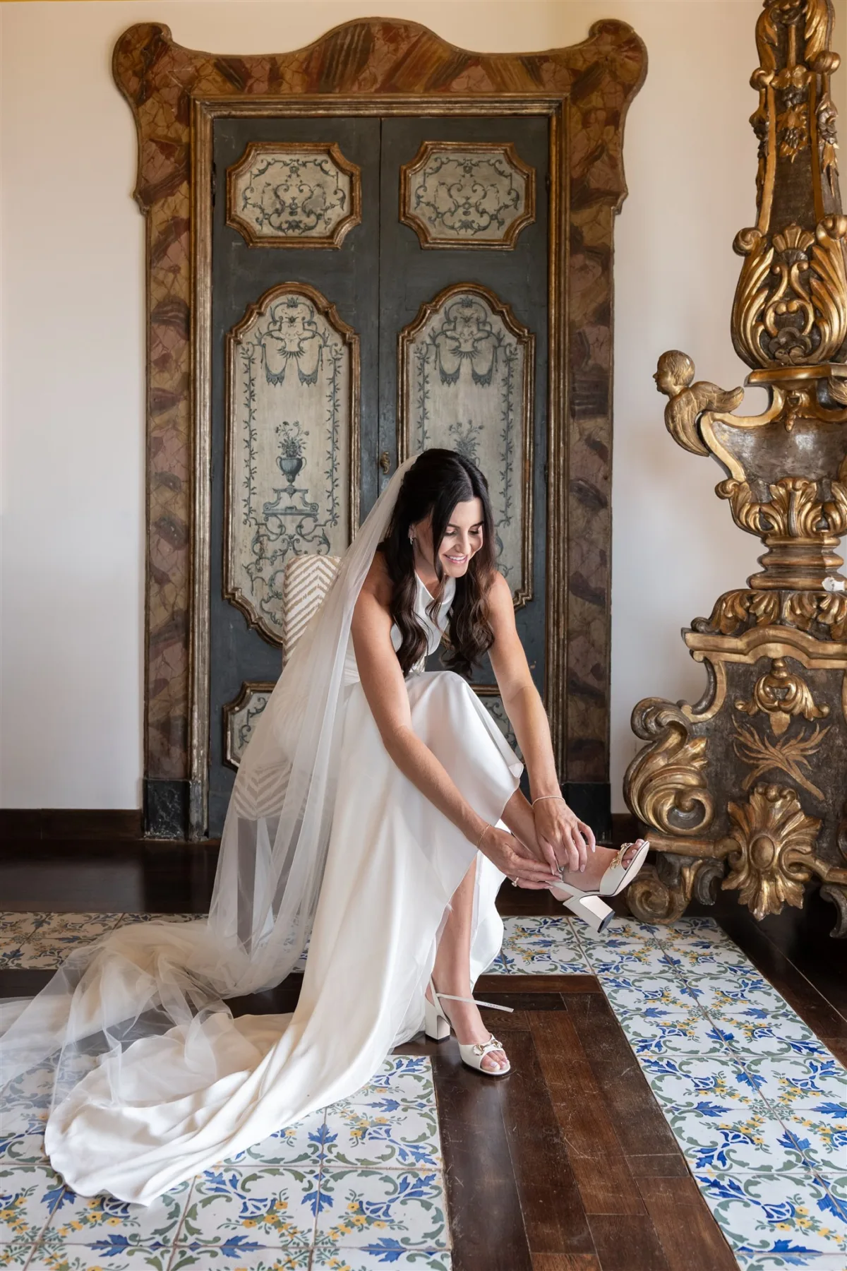 bride getting ready amalfi coast wedding planning engaging events ali capo santa fortunata - An Effortless Amalfi Coast Celebration Bride putting on wedding shoes at Capo Santa Fortunata venue in Sorrento Italy with wedding planning by Engaging Events by Ali