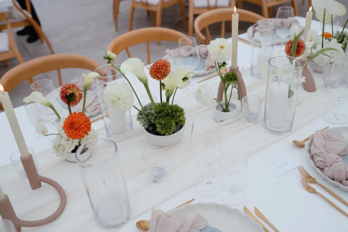 cabo destination wedding tablescape the cape thompson hotel - Luxury Cabo Wedding at The Cape, a Thompson Hotel Elegant white and coral wedding tablescape with candles and floral arrangements at The Cape Thompson Hotel Cabo destination wedding