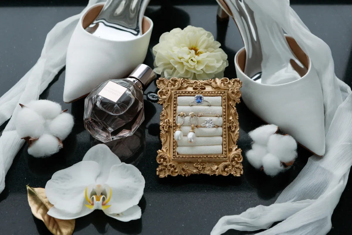 chicago wedding details ritz carlton engaging events by ali planning - A Golden Ritz-Carlton Chicago Celebration Elegant white wedding shoes, perfume, jewelry and flowers arranged for a luxury Chicago wedding at The Ritz-Carlton planned by Engaging Events by Ali