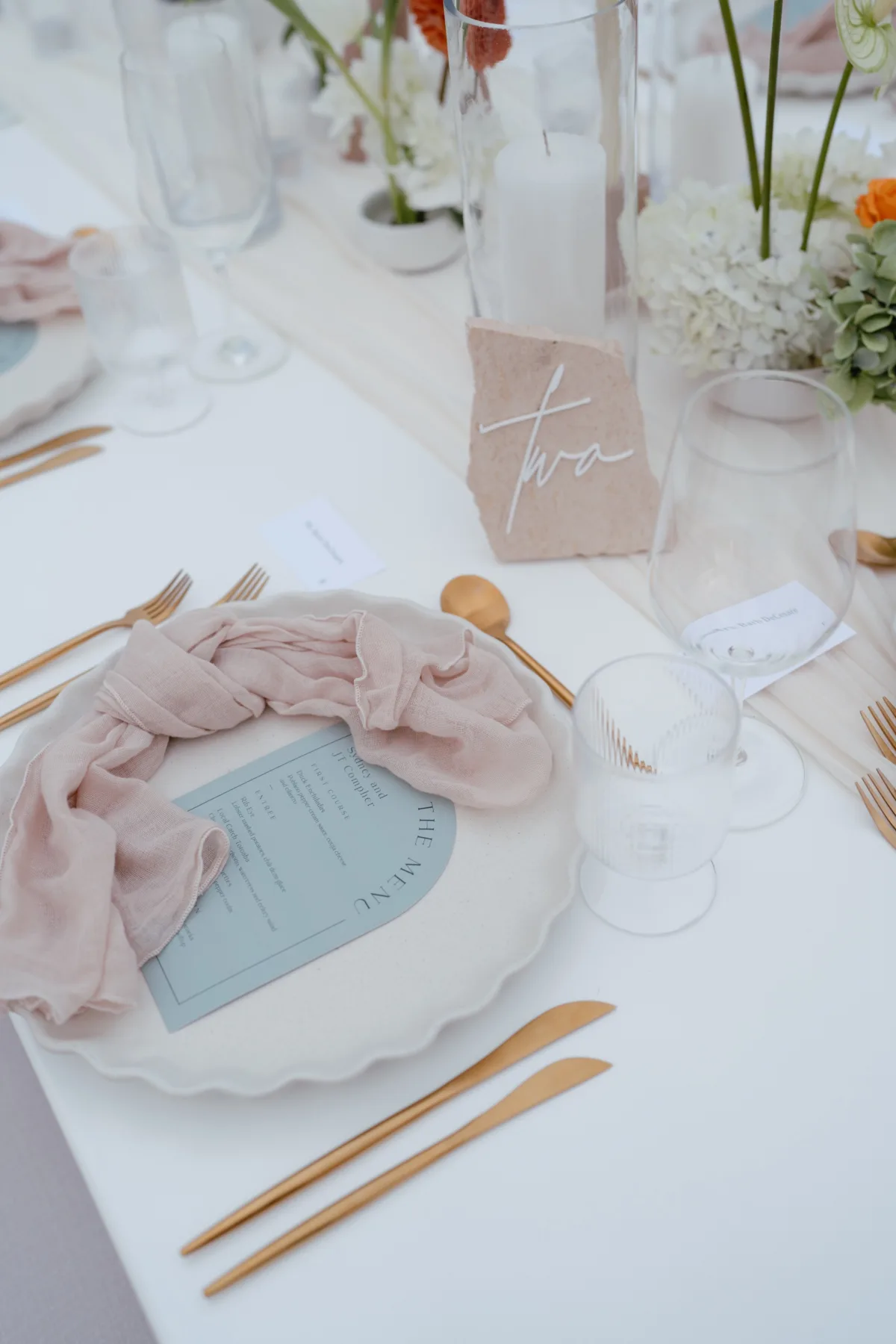 luxury cabo destination wedding tablescape engaging events by ali - Luxury Cabo Wedding at The Cape, a Thompson Hotel Elegant blush and blue wedding tablescape with silk napkins and florals at luxury Cabo destination wedding planned by Engaging Events by Ali