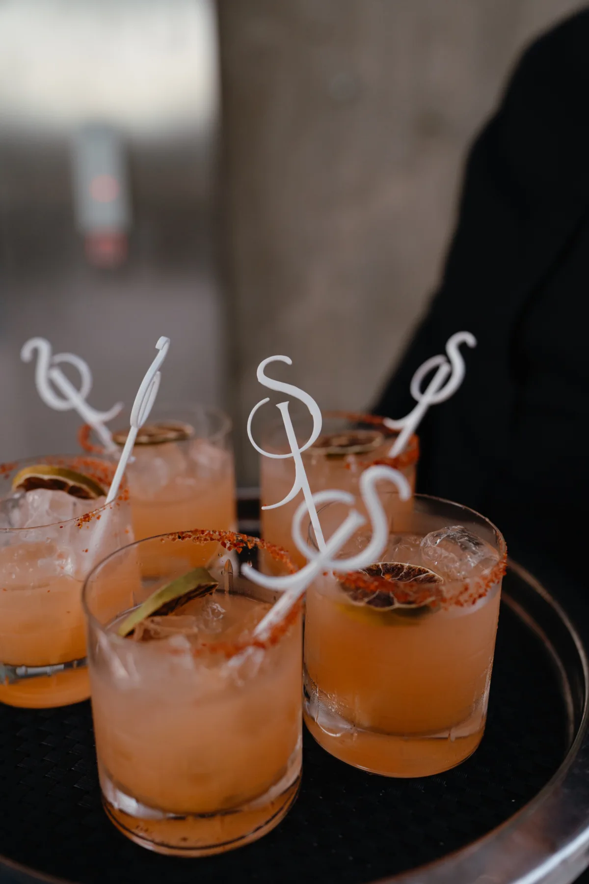 luxury cabo wedding cocktails engaging events by ali planning cape thompson hotel - Luxury Cabo Wedding at The Cape, a Thompson Hotel Elegant orange cocktails with spiced rim garnish at luxury Cabo destination wedding at The Cape Thompson Hotel planned by Engaging Events by Ali
