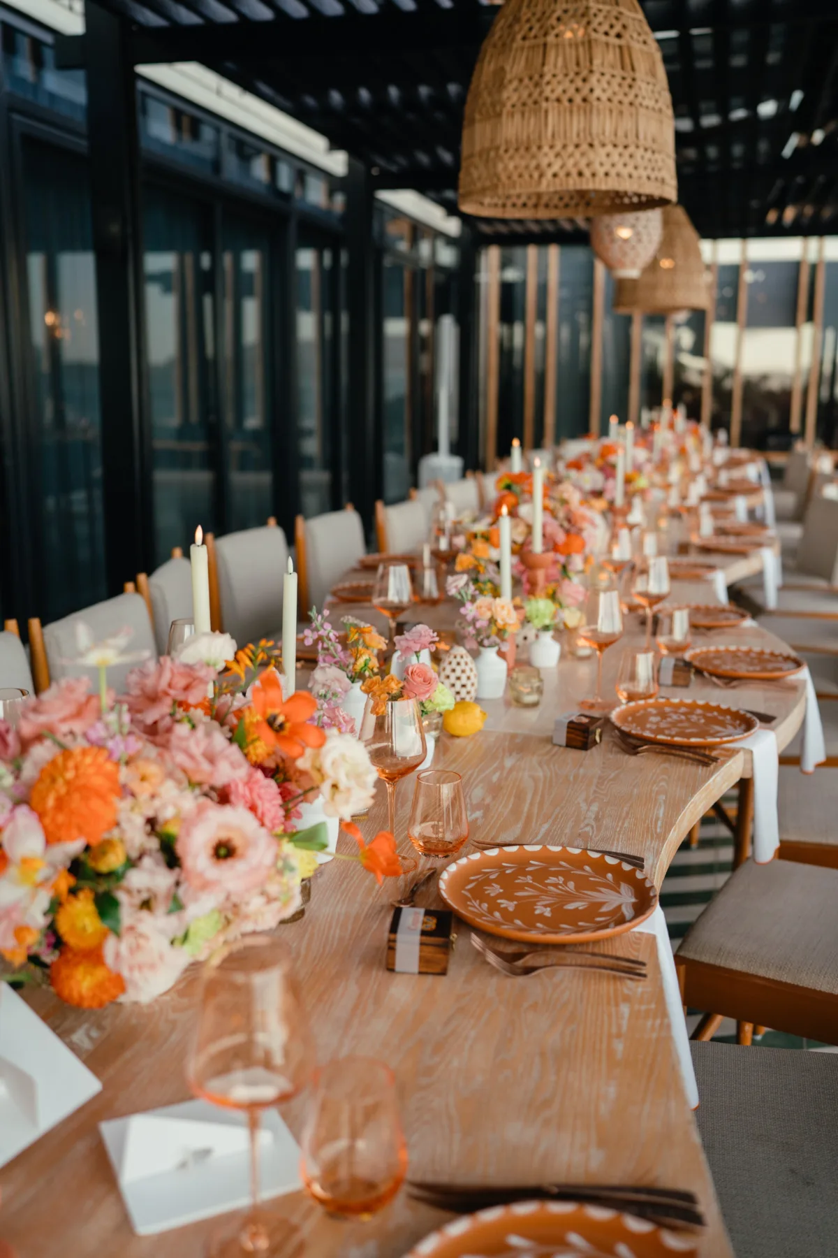 luxury cabo wedding tablescape the cape thompson hotel destination planning - Luxury Cabo Wedding at The Cape, a Thompson Hotel Luxury destination wedding tablescape with vibrant floral arrangements and elegant place settings at The Cape Thompson Hotel in Cabo planned by Engaging Events by Ali