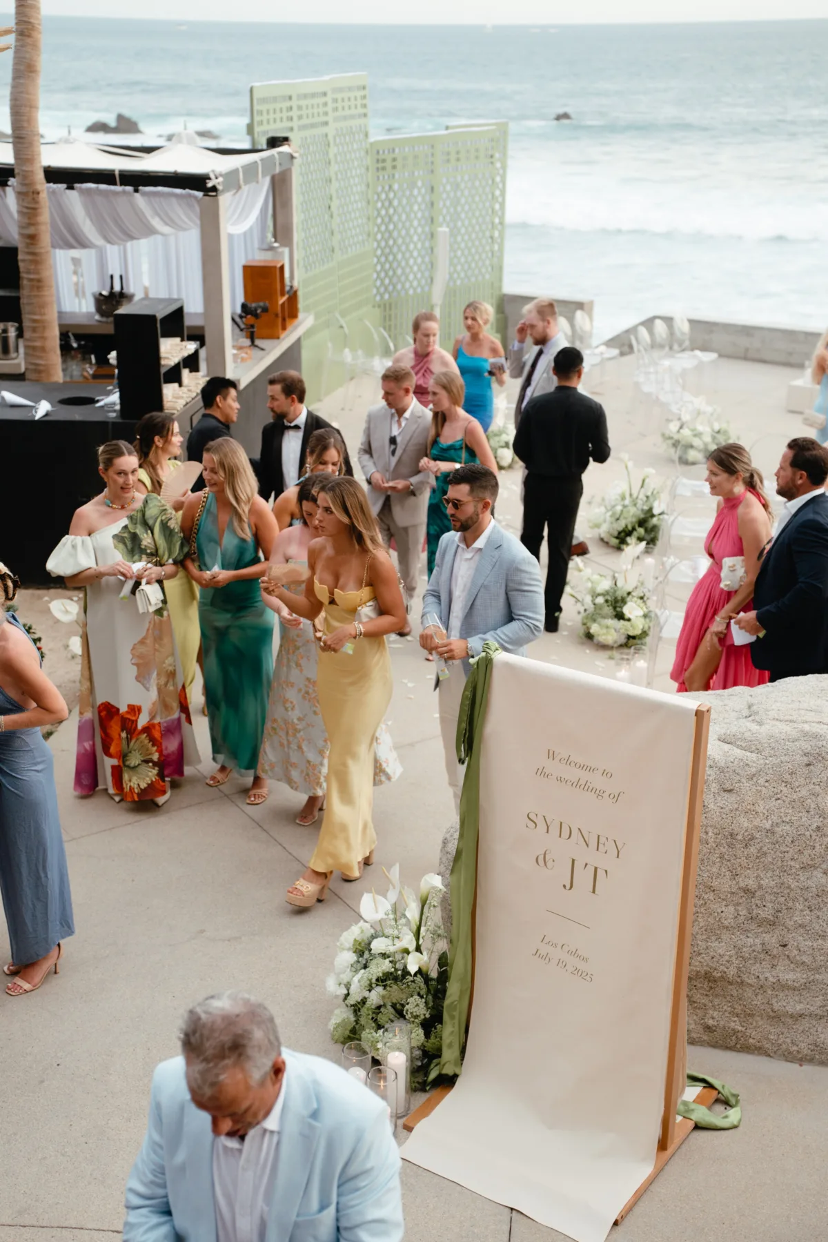 luxury destination wedding ceremony cabo thompson hotel engaging events - Luxury Cabo Wedding at The Cape, a Thompson Hotel Elegant beachside wedding ceremony at The Cape Thompson Hotel in Cabo planned by Engaging Events by Ali with guests in formal attire