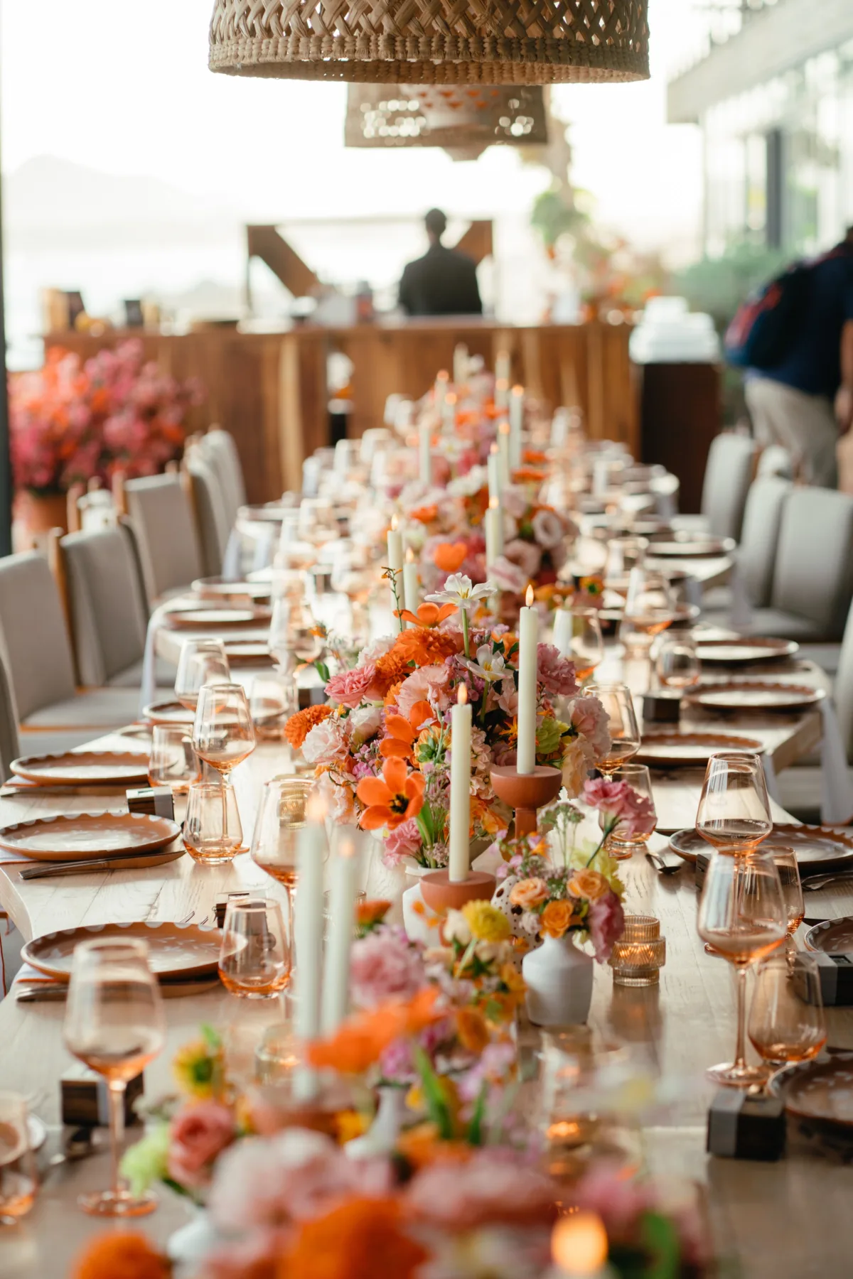 luxury destination wedding reception tablescape cabo thompson hotel - Luxury Cabo Wedding at The Cape, a Thompson Hotel Elegant wedding reception tablescape with colorful floral centerpieces and candles at The Cape Thompson Hotel in Cabo planned by Engaging Events by Ali