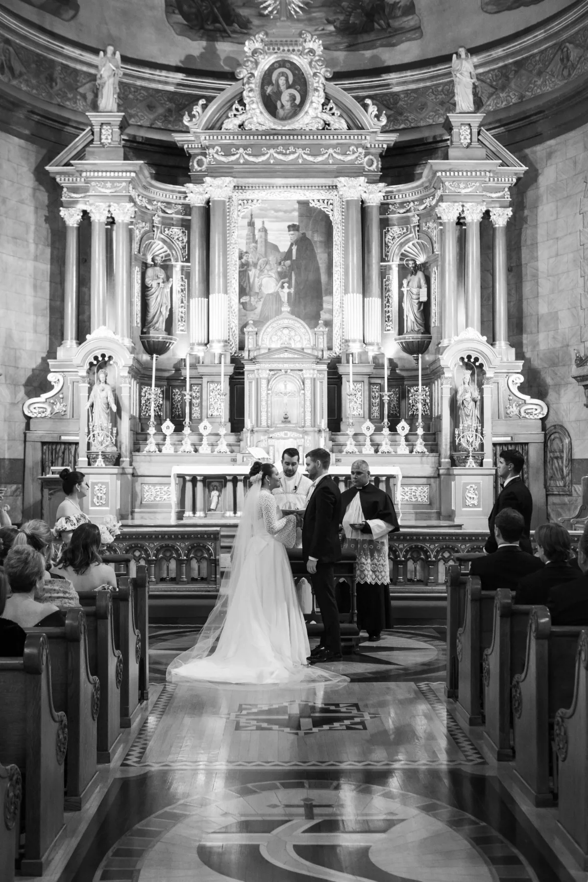 wedding planning engaging events ali chicago ceremony - A Golden Ritz-Carlton Chicago Celebration Elegant wedding ceremony with bride and groom exchanging vows in ornate chapel, planned by Engaging Events by Ali